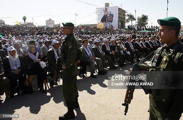 Presidential guard soldiers survey the crowd as Palestinian President Mahmud Abbas speaks during ceremonies to commemorate the second anniversary of...