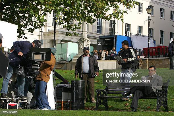 United Kingdom: Indian actor Paresh Rawal waits for director of photography Nirmal Jani to get ready while filming the Bollywood production "Hat...