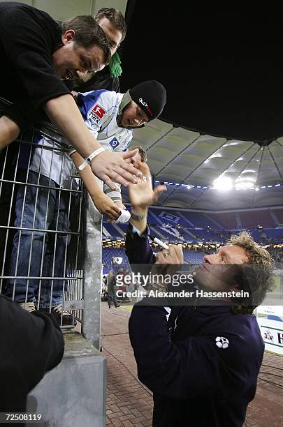 Thomas Doll, head coach of Hamburg, shakes hands with supporters of his team after the Bundesliga match between Hamburger SV and Borussia...