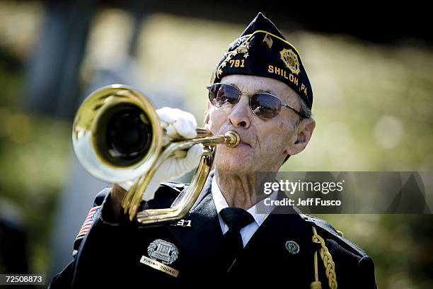 War Veteran William Biddle plays Taps at a Veterans Day ceremony at the Prospect Hill Cemetery November 11, 2006 in York, Pennsylvania. More than 180...