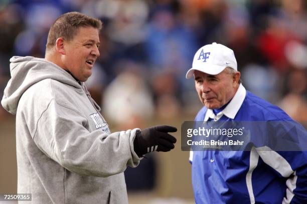 Head coach Charlie Weis of the Notre Dame Fighting Irish talks with head coach Fisher DeBerry of the Air Force Falcons before their game on November...