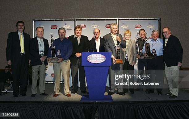 Mike Helton, president of NASCAR, Jim Williams and Bob DeFazio of the Irwindale Speedway, Jimmy Spencer, Dick Berggren, Jim and Barbara Chromarty of...