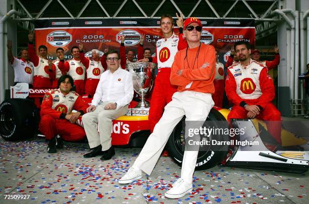 Sebastien Bourdais , driver of the Newman Haas Racing Lola Cosworth, celebrates his third championship with team owner Paul Newman and Carl Haas at...