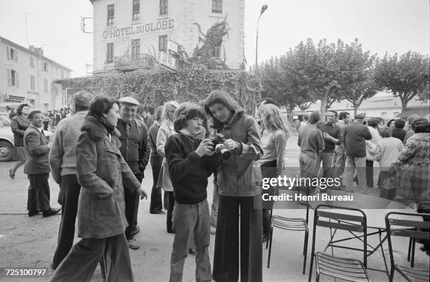 Jacqueline Kennedy Onassis and her son, John F. Kennedy Jr. Taking pictures during a holiday in the Camargue region of southern France, 5th November...