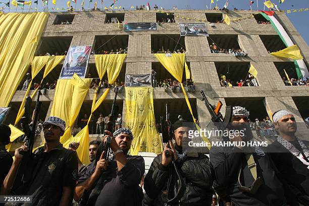 Armed Palestinian Fatah supporters take part in a rally marking the second anniversary of the death of veteran Palestinian leader Yasser Arafat in...