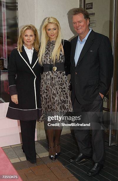 Kathy and Rick Hilton pose with daughter Paris at the launch of her perfume 'Heiress,' at the BT2 Store on Novemver 11, 2006 in Dublin, Ireland.