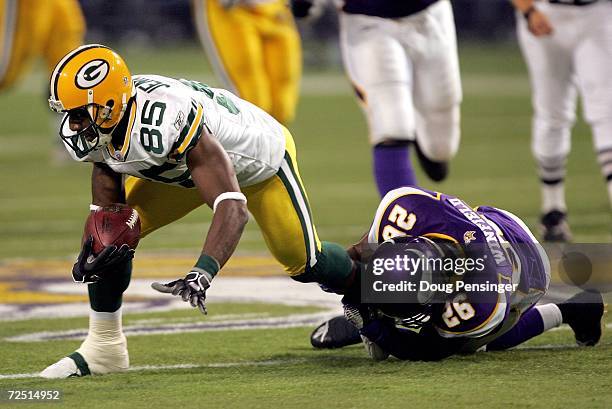 Greg Jennings of the Green Bay Packers makes a 12 yard reception from Brett Favre and was able to lateral it to Donald Driver before being tackled by...
