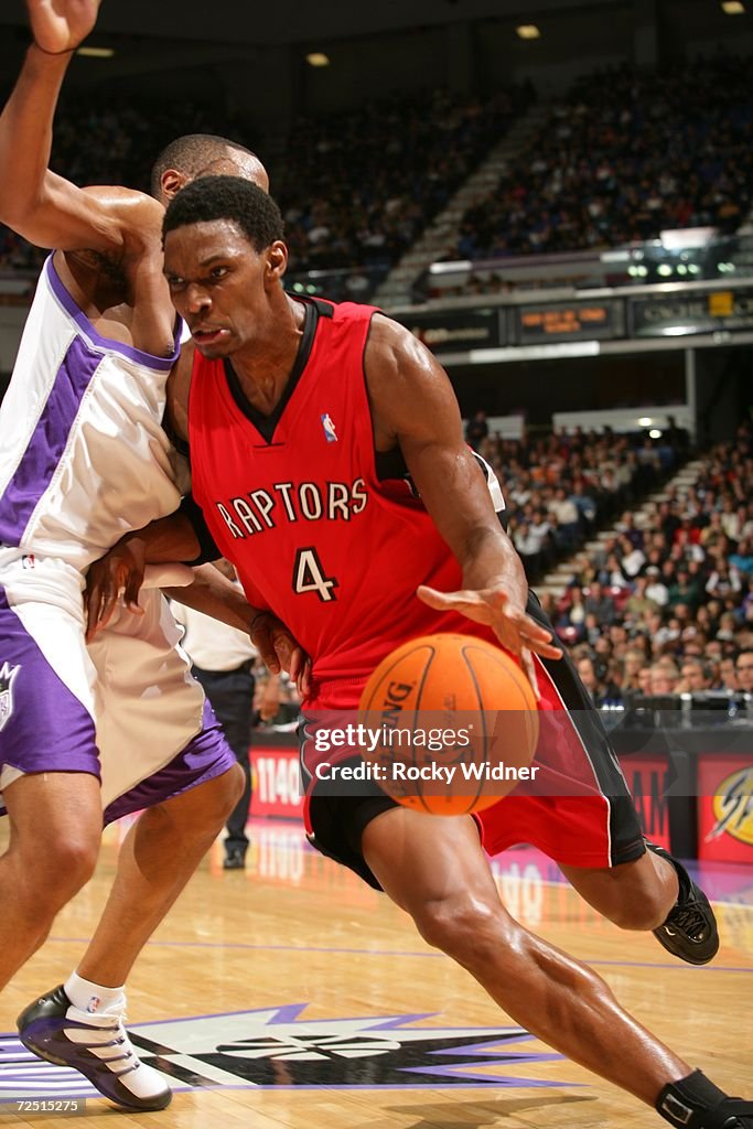 Bosh Raptors Chris Bosh of the Toronto Raptors drives to the basket against Kenny ...
