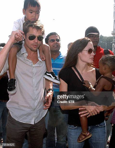 Actors Brad Pitt with son Maddox and Angelina Jolie with daughter Zahara take a stroll on the seafront promenade in Mumbai, 12 November 2006. Jolie...