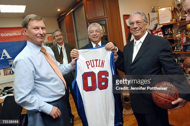 Commissioner David Stern and Los Angeles Clippers owner Donald Sterling present a Putin jersey to Russian defence minister Sergei Ivanov during...