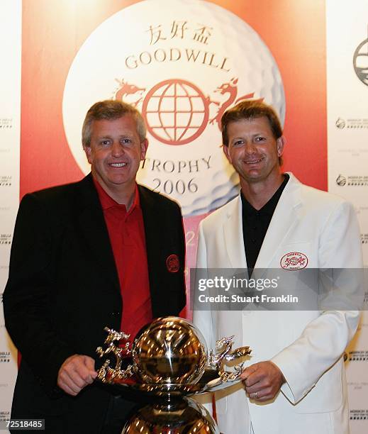 Colin Montgomerie, Captain of The team of Ryder Cup Nations stand with Retief Goosen, Captain of The International team during the first day of The...