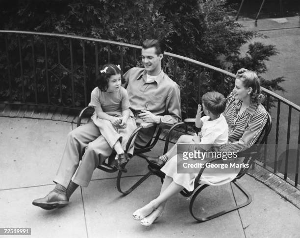 1950s: Family on outdoor patio.