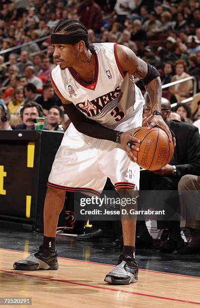 Guard Allen Iverson of the of the Philadelphia 76ers holds the ball during the NBA game against the San Antonio Spurs at First Union Center in...