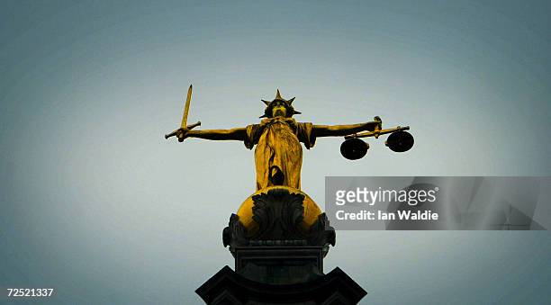 Statue of the scales of justice stands high above the Old Bailey on December 12, 2003 in London. Ian Huntley is accused of murdering youngsters...