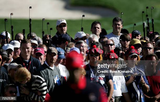 Spectators watch Tiger Woods during his four-ball match against European team players Darren Clarke and Ian Poulter in the morning four-ball matches...