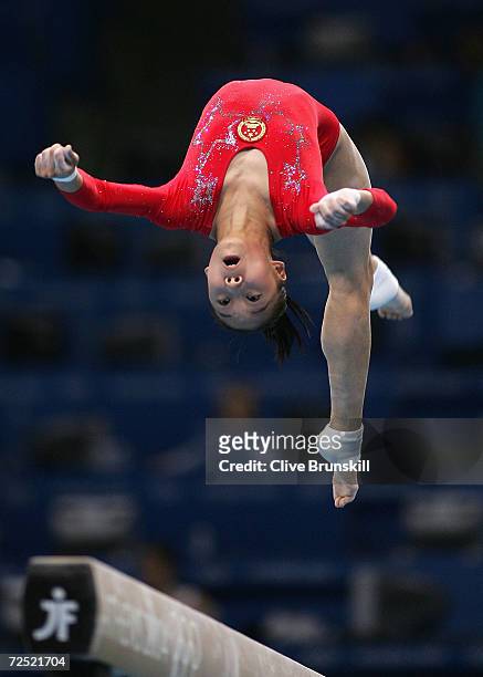 Tiantian Wang of China competes in the qualification round of the team event at the women's artistic gymnastics competition on August 15, 2004 during...
