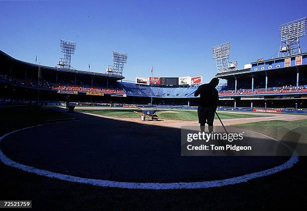 General view of a groundkeeper before a game between the Texas Rangers and the Detroit Tigers at Tiger Stadium in Detroit, Michigan. The Tigers...