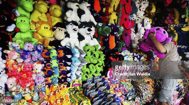Stall holder completes his display of stuffed toy prizes as preparations for the Sydney Royal Easter Show get underway March 16, 2005 in Sydney...