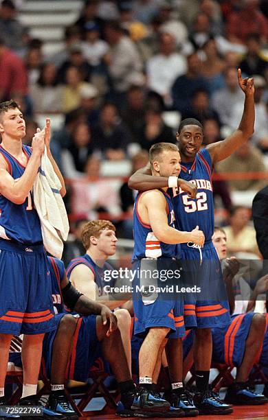 Kenyan Weaks and Teddy Dupay of the Florida Gators celebrate at the sidelines during the NCAA East Regional Game against the Oklahoma Cowboys at the...