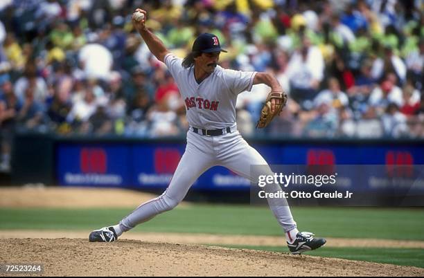 Pitcher Dennis Eckersley of the Boston Red Sox winds up for the pitch during a game against the Oakland Athletics at the Oakland Coliseum in Oakland,...