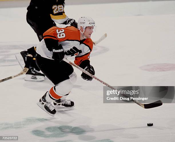 Center Marty Murray of the Philadelphia Flyers carries the puck through center ice against the Pittsburgh Penguins during the NHL game at the First...