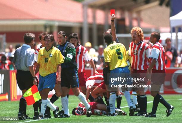 LEONARDO OF BRAZIL ARGUES WITH THE LINESMAN AFTER BEING SENT OFF FOR AN ELBOW TO THE HEAD OF TAB RAMOS OF THE USA DURING THE BRAZIL VERSUS USA MATCH...