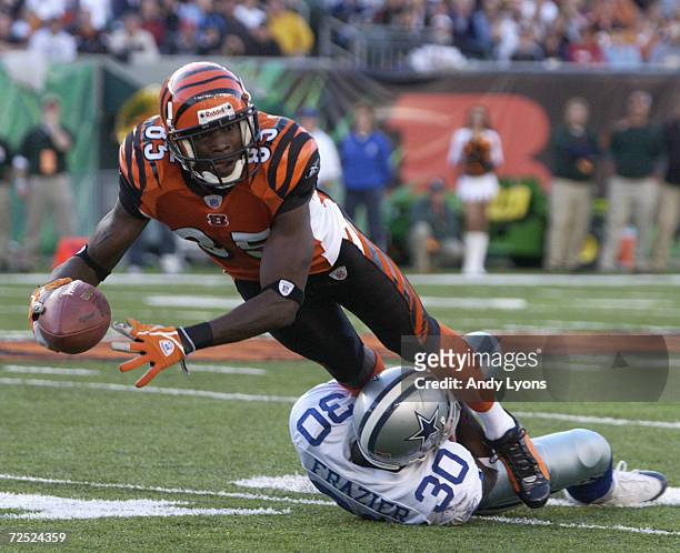 Wide receiver Chad Johnson of the Cincinnati Bengals is tackled by cornerback Lance Frazier of the Dallas Cowboys during the game at Paul Brown...