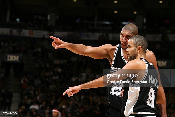Tony Parker of the San Antonio Spurs talks with his teammate Tim Duncan during the game against of the Toronto Raptors on November 5, 2006 at Air...