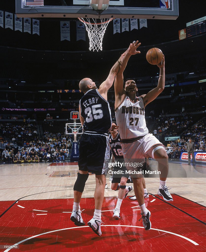 Mengke Center Mengke Bateer of the Denver Nuggets shoots the ball as forward ...