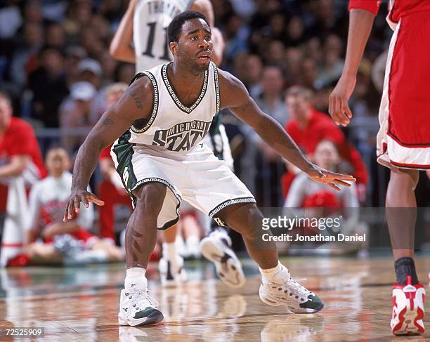 Mateen Cleaves of the Michigan State Spartans guards his player during the NCAA Tournament Game against the Utah Runnin Utes at the Cleveland State...