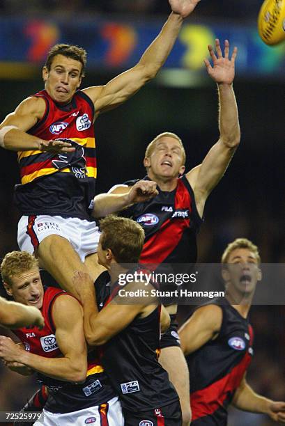 Ryan Fitzgerald of Adelaide fly's for the ball over Dustin Fletcher of Essendon during the AFL Match between Essendon Bombers and the Adelaide Crows...
