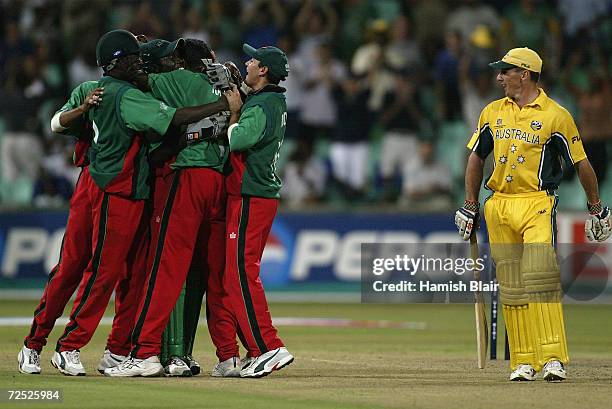 Kenyan players celebrate the wicket of Brad Hogg of Australia caught and bowled by Aasif Karim for a duck during the World Cup Super Six One Day...