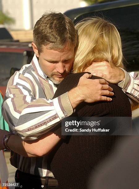 Damon van Dam embraces his wife Brenda during a press conference at their home February 26, 2002 in the Sabre Springs section of San Diego, CA. The...