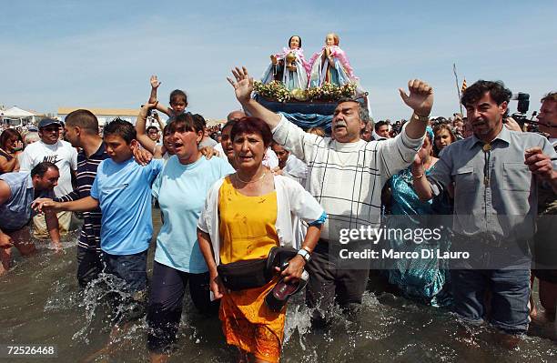 Gypsies carry the statue of Saint Marie-Jacob and Saint Marie-Salom to the sea in Saintes Maries de la Mer in the Camargue region of Southern France...