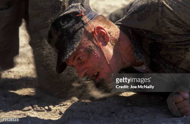 Navy Seal trainee falls from the rigors of his assignment in this undated photo taken in 2000 at the Coronado Naval Amphibious Base in San Diego,...