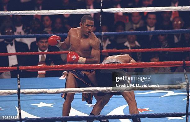 Sharmba Mitchell punches Reggie Green in the stomach during the Triple Jeopardy Boxing Match at the MCI Center in Washington, D.C. Mitchell defeated...