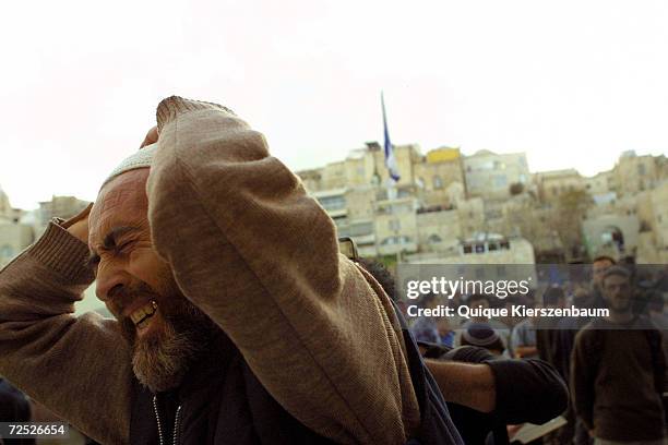 Jewish man cries out at Jerusalems Western Wall, Judaisms holiest site, during a mass prayer called by Israels chief rabbis, March 13, 2002. Jewish...