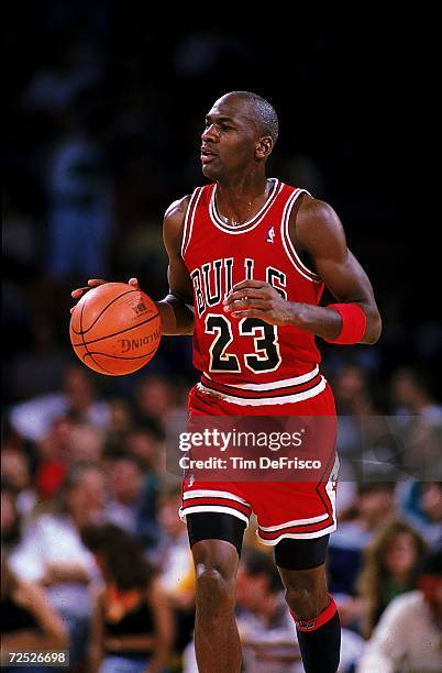 Michael Jordan of the Chicago Bulls runs with the ball during the game. Mandatory Credit: Tim DeFrisco /Allsport