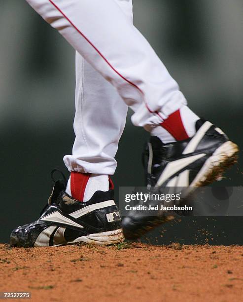 Curt Schilling of the Boston Red Sox winds up to throw a pitch in the first inning against the St. Louis Cardinals during game two of the World...