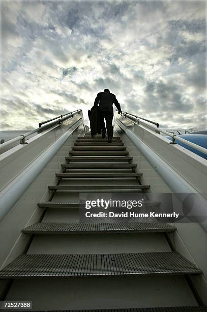 Secretary of Defense Donald Rumsfeld boards his plane February 25, 2004 in Tashkent, Uzbekistan as he heads for meetings in Kazakhstan. Rumsfeld is...