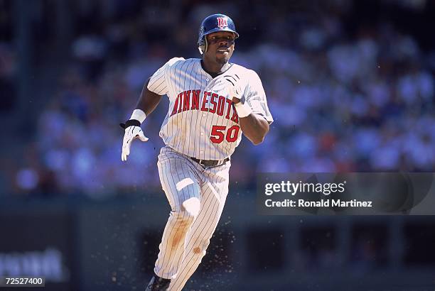 Matt Lawton of the Minnesota Twins runs to base during the game against the Texas Rangers at The Ball Park in Arlington, Texas. The Twins defeated...