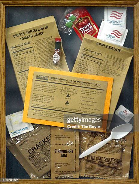 The contents of a "Cheese Tortellini in Tomato Sauce" Meals, Ready to Eat package is displayed under a glass frame February 21, 2002 at the Army-Navy...