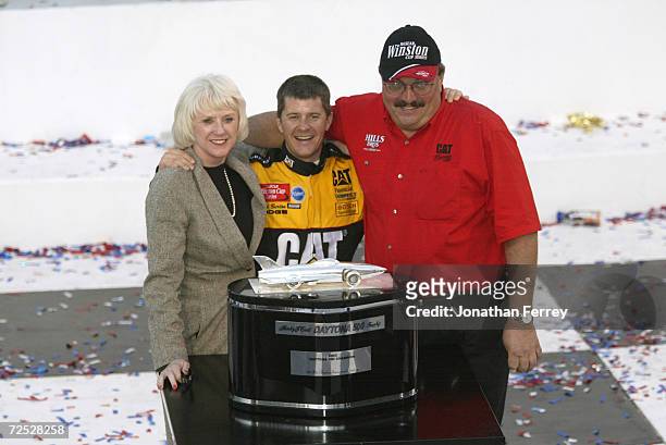 Ward Burton driver of the Bill Davis Racing Dodge Intrepid R\\T celebrates with team onwers Bill and Gail Davis after winning the 44th NASCAR Winston...