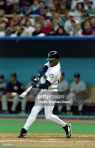 Ken Griffey Jr. Of the Seattle Mariners hits the ball during the game against the New York Yankees at the Kingdome in Seattle, Washington. The...