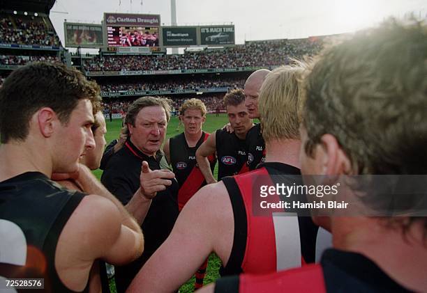 Kevin Sheedy, coach of Essendon, talks with his team after their win, after the AFL Preliminary Final match played between the Essendon Bombers and...