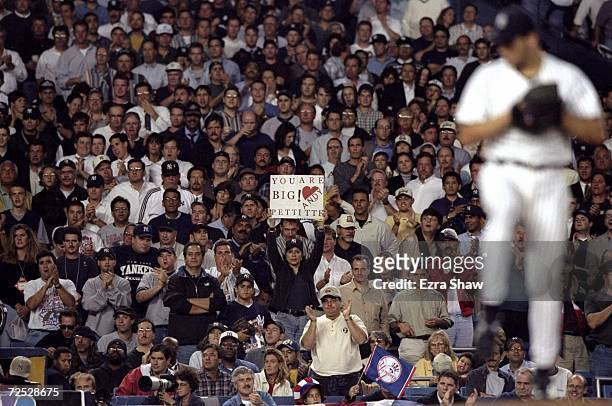 Fans cheer on pitcher Andy Pettitte of the New York Yankees during game two of the American League Divisional Series against the Texas Rangers at the...