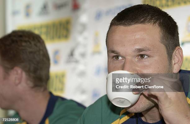 Mark Viduka of Australia sips a cup of coffe during a press conference today as Australia prepare to play France on Sunday at the MCG. Crown Towers,...