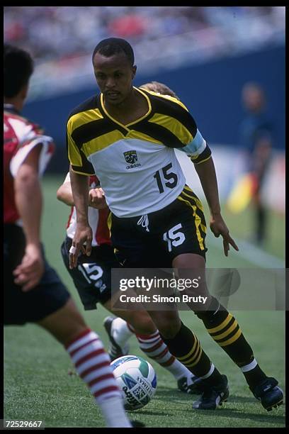 Doctor Khumalo of the Columbus Crew moves the ball against the Dallas Burn during an MLS game played at the Cotton Bowl in Dallas, Texas. The Burn...