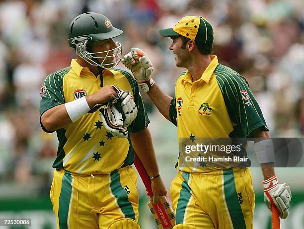 Darren Lehmann and Damien Martyn of Australia leave the field together at the end of the innings during game one of the VB Series One Day...