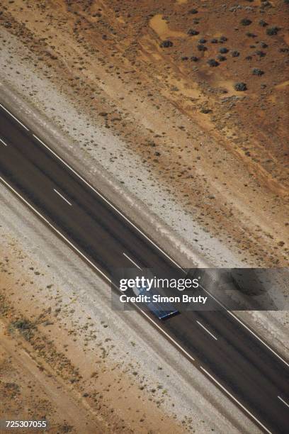 The General Motors Sunraycer solar-powered car drives on Stuart Highway during the inaugural Darwin to Adelaide Pentax World Solar Challenge race on...